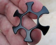 reloading-the-revolver-moon-clip-stamped The moon clip is stamped from thin spring steel with a shape designed to maintain a secure grip on the cartridges.