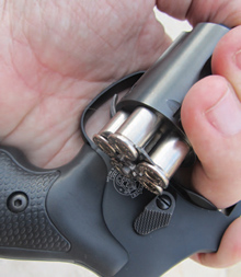 reloading-the-revolver-the-spring-steel The spring steel moon clip assists with loading and unloading a revolver.