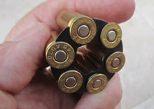 reloading-the-revolver-a-black-moon-clip A black moon clip for .45 ACP concealed carry revolver.