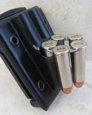 reloading-the-revolver-a-blade-tech-twin-moon A Blade-Tech Twin Moon Clip Belt Holder showing only one moon clip.