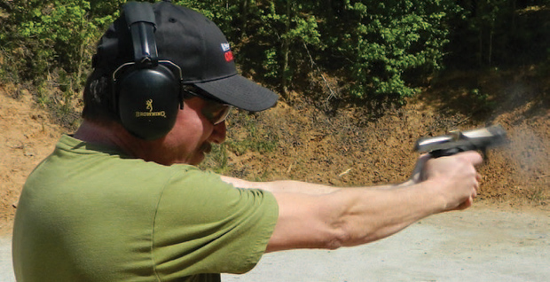mastering-the-doube-action-pistol-shot-has-broken The shot has broken and Ronald Freeman is on target.