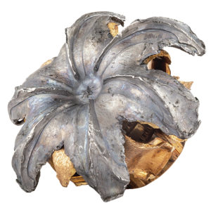 A round of 10mm hollow-point ammunition that has "mushroomed" after impacting a target.