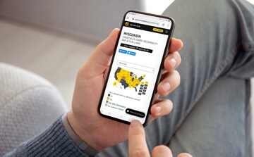 Hand holding phone with recitprocity map on it